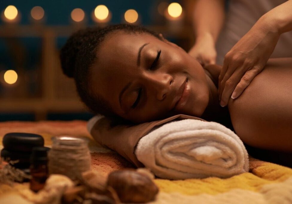 Smiling woman enjoying candlelit spa massage